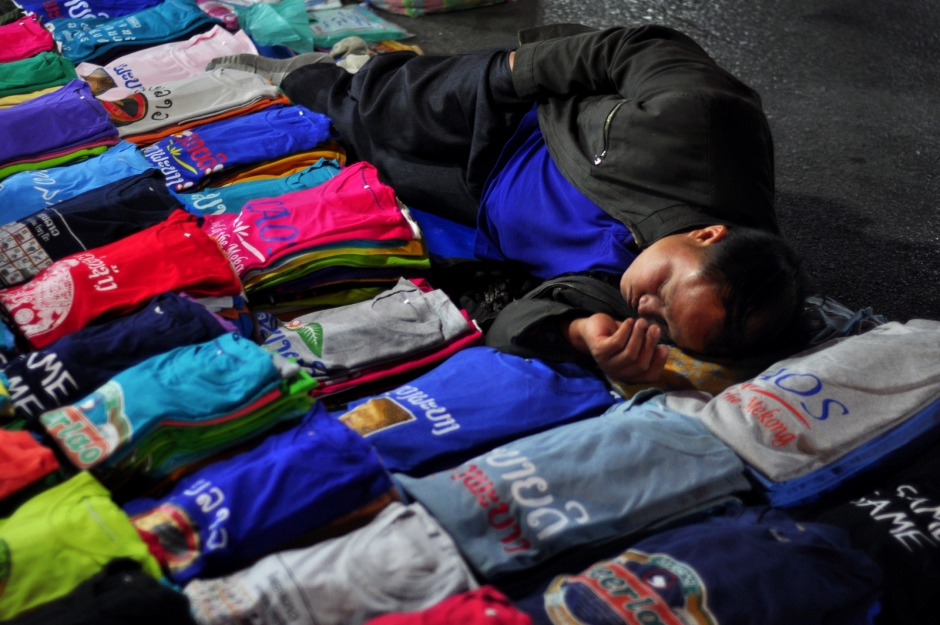 Having a nap - night market seller